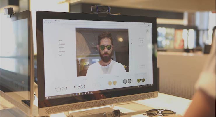 A computer screen with a man on it, showcasing Vu, la lunetterie à Montréal avec le plus grand inventaire de montures.