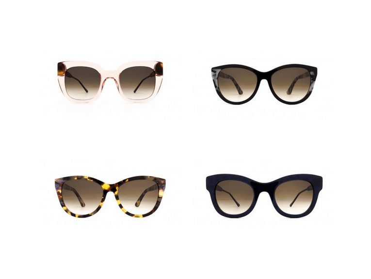 Four pairs of cat-eye sunglasses from Vu, la lunetterie à Montréal, are displayed on a white background: one clear, one black, one tortoiseshell, and one solid dark frame—all with stylish brown gradient lenses.