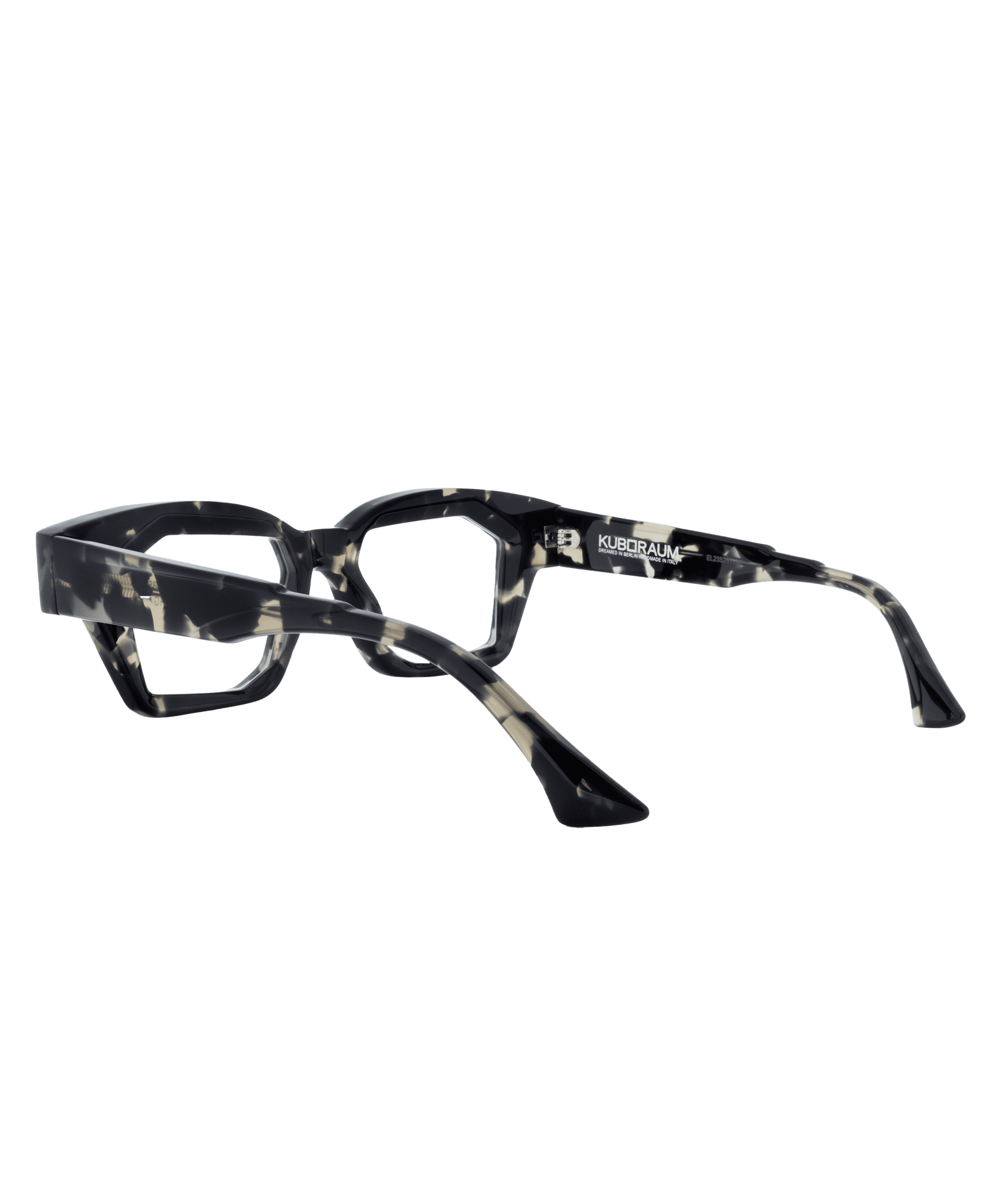 A pair of uniquely designed black and white marbled eyeglasses with thick, geometric frames and sharply angled arms from Vu, la lunetterie à Montréal, positioned on a plain white background.