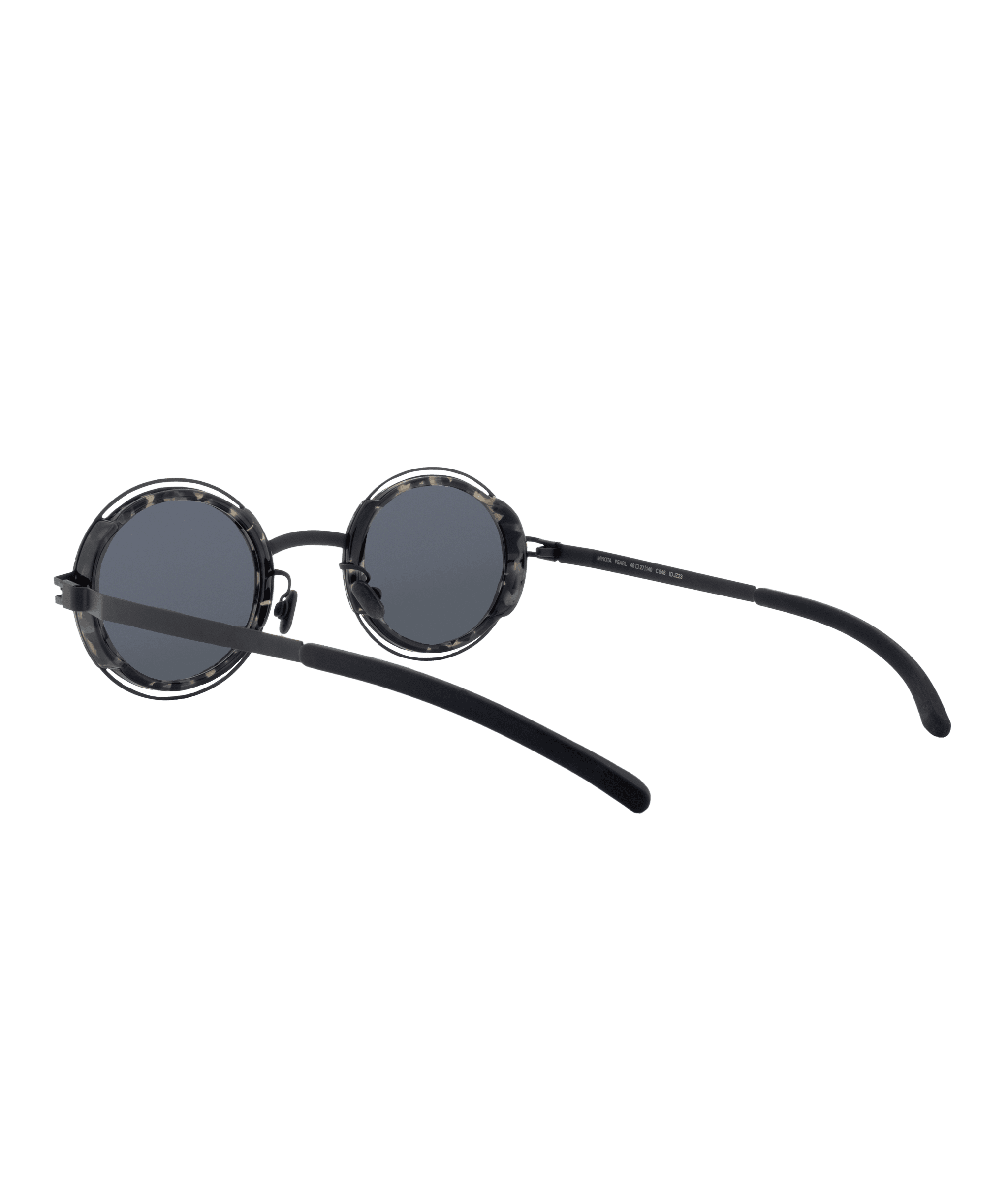 Round, black sunglasses with dark lenses and thin, black arms, shown on a white background at an angle to highlight the frame and side details—discover this style at Vu, la lunetterie à Montréal.