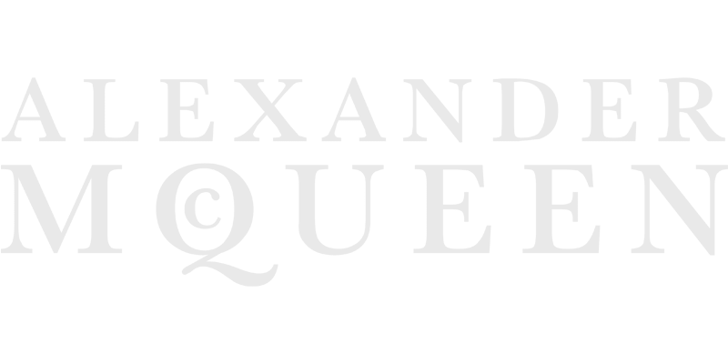 Faded gray text on a light background spells ALEXANDER McQUEEN in large, elegant serif font—a refined touch for any lunetterie à Montréal.