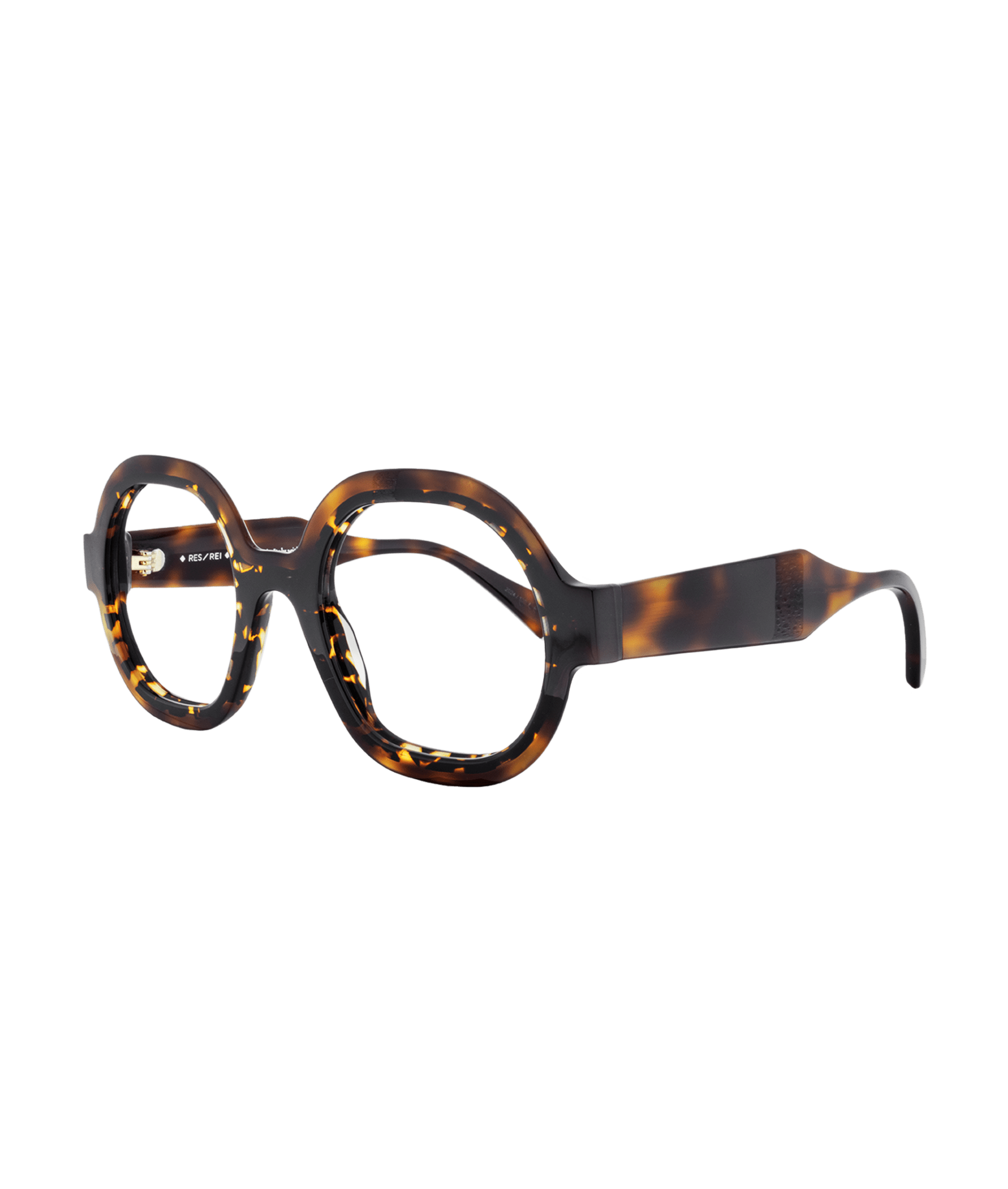 The frame is made from high-quality acetate in a warm, earthy brown shade, featuring subtle variations that enhance its depth and richness. The shape is gently rounded with soft, angular edges, creating a balanced design that complements a range of face shapes.