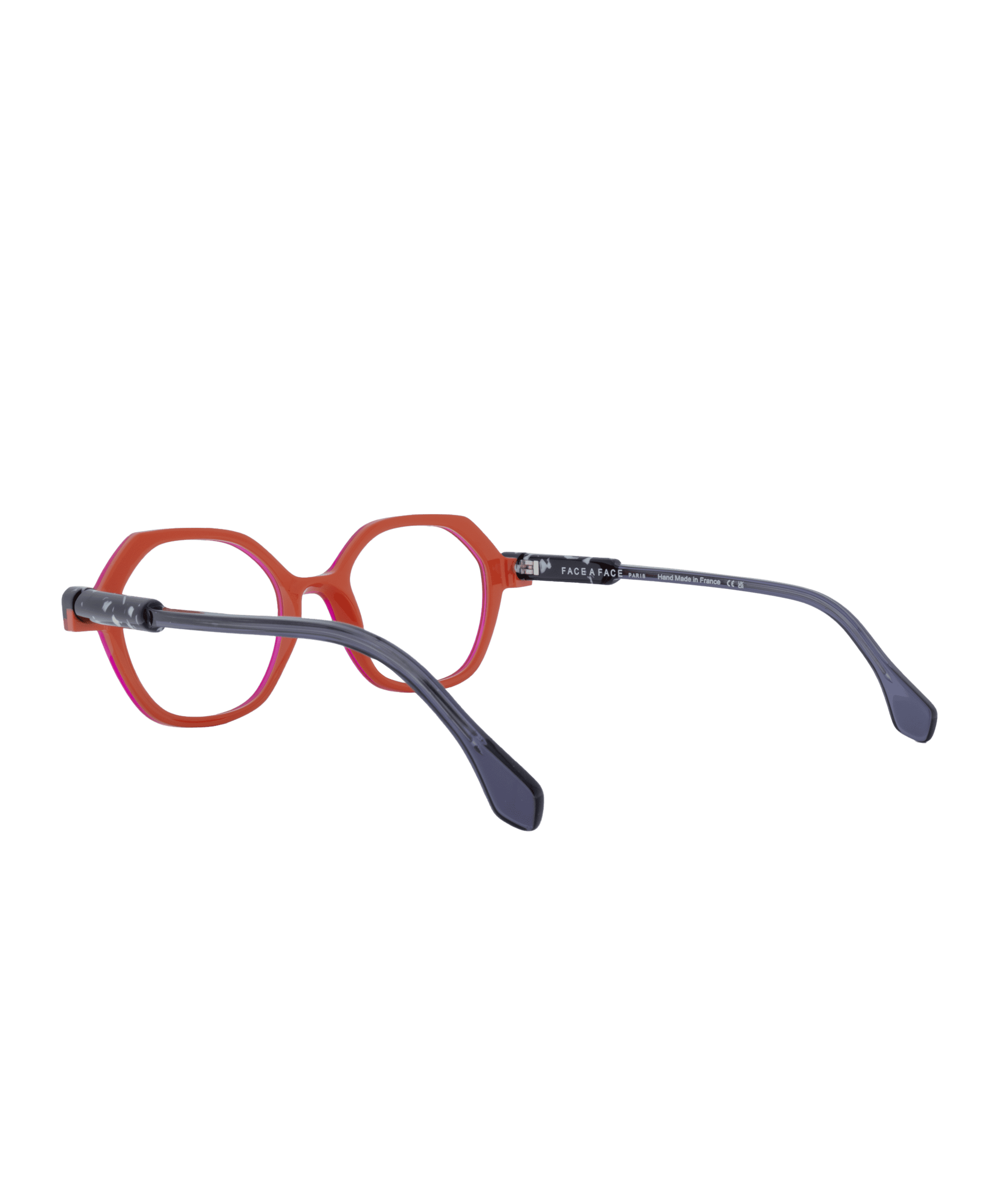 The KYOTO2 eyeglasses from La lunetterie VU à Montréal feature red octagonal frames with black temples, displayed against a white background to show both the front and side views.