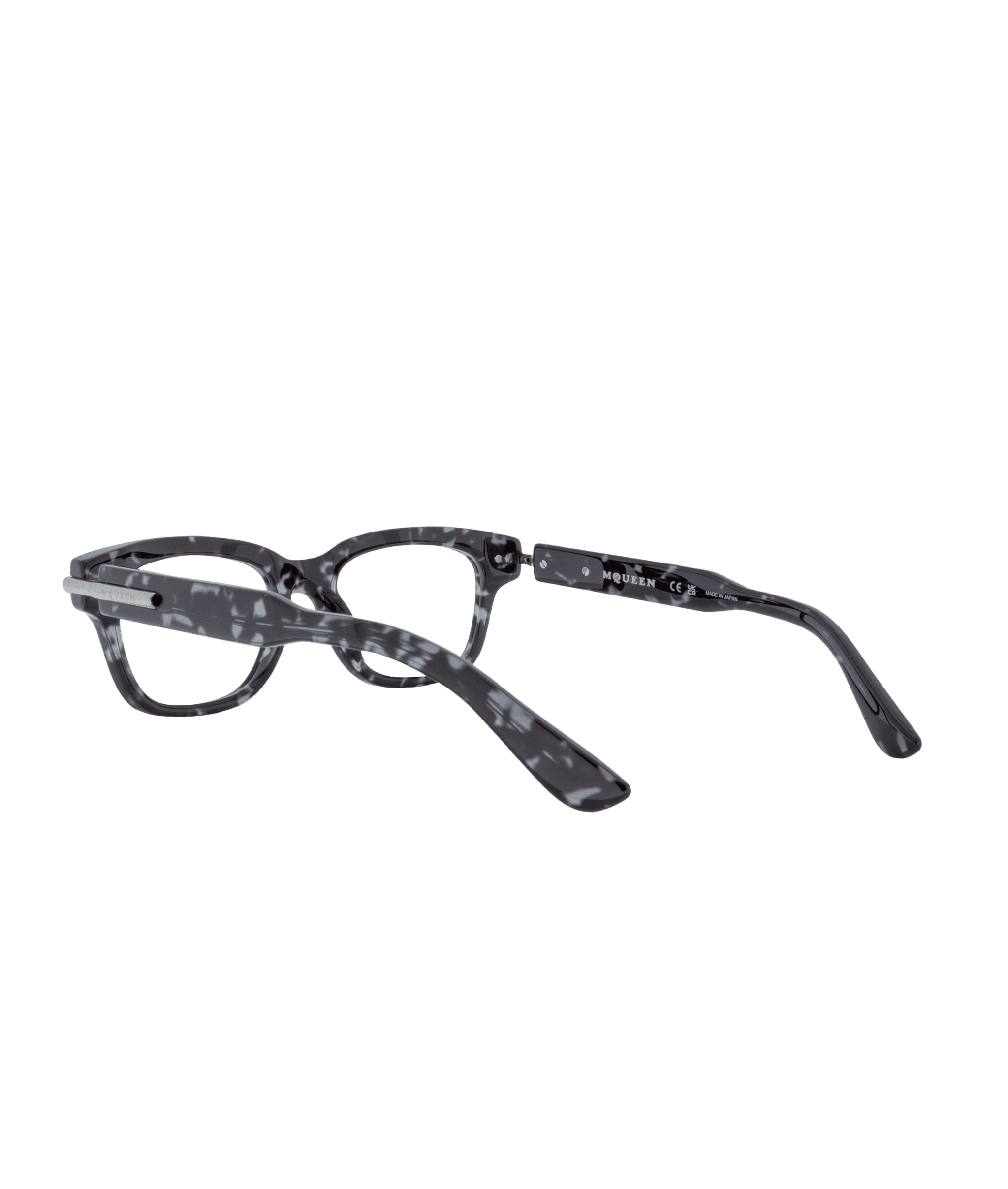 The 0497O eyeglasses from La lunetterie VU à Montréal have black and white marbled frames, shown from a low rear angle with open temples against a plain white background.