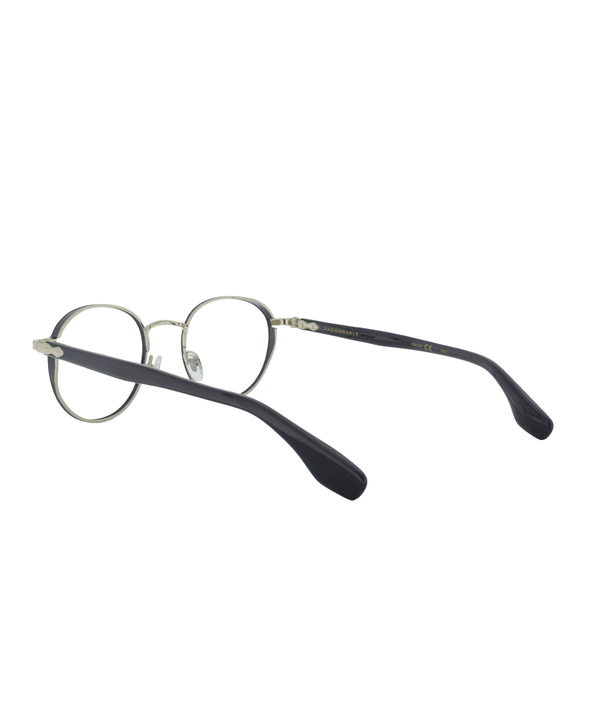 A pair of round, metal-framed eyeglasses from La lunetterie VU à Montréal, featuring thin black arms and clear nose pads, shown from a three-quarter rear angle on a white background.