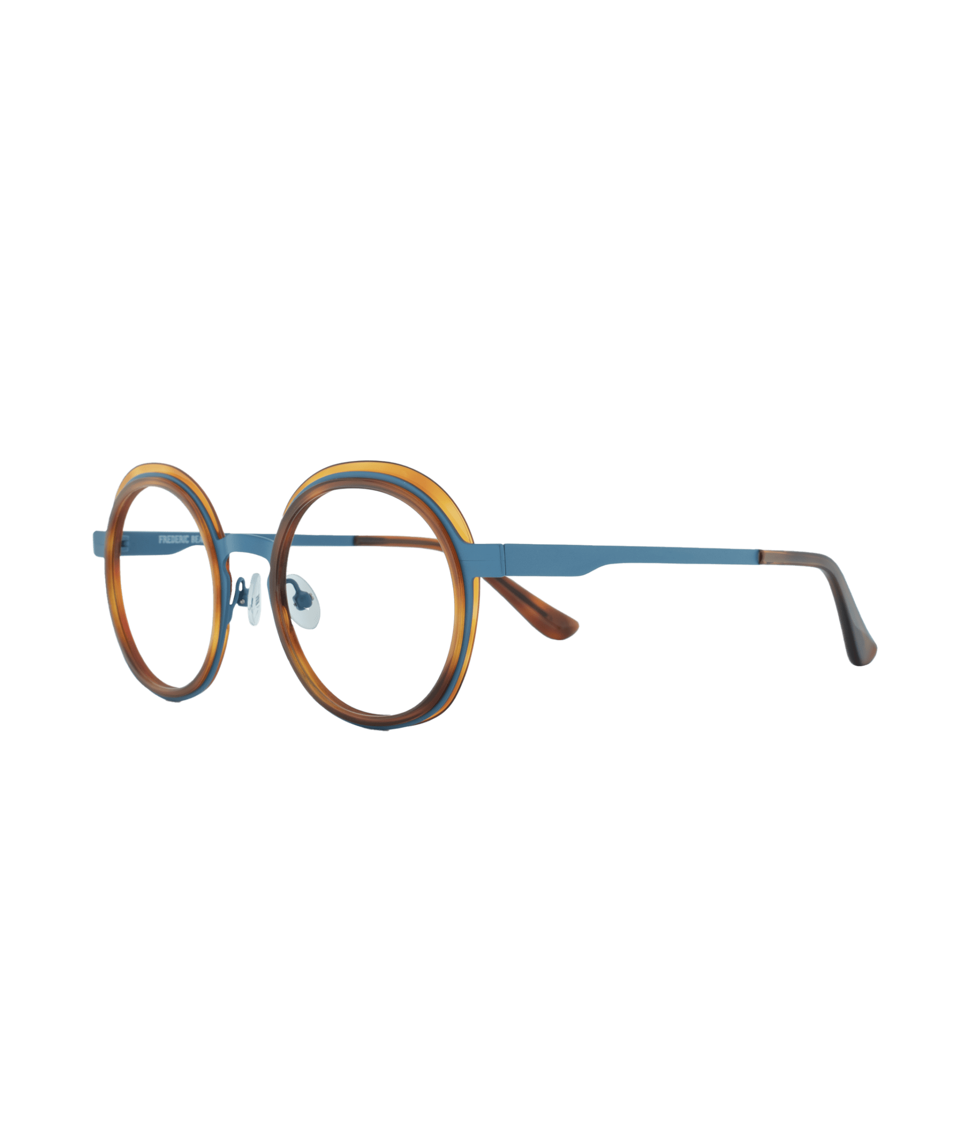 Dare to embrace elegant contrast. This round frame with nose pads captivates with a beautiful combination of complementary colors, blending deep blue with warm orange accents. Made in France, it reflects meticulous craftsmanship and original design, offering a style that is both creative and refined.